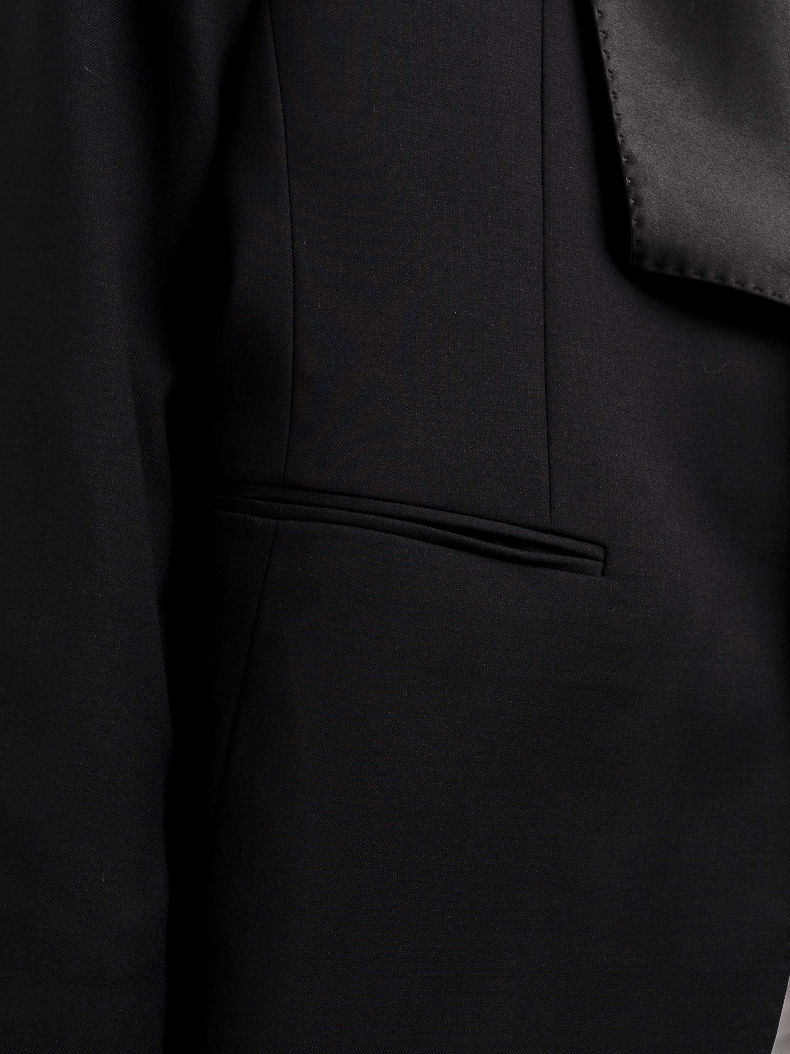 Black men's suit jacket with satin lapel and welt pocket, formal wear detail