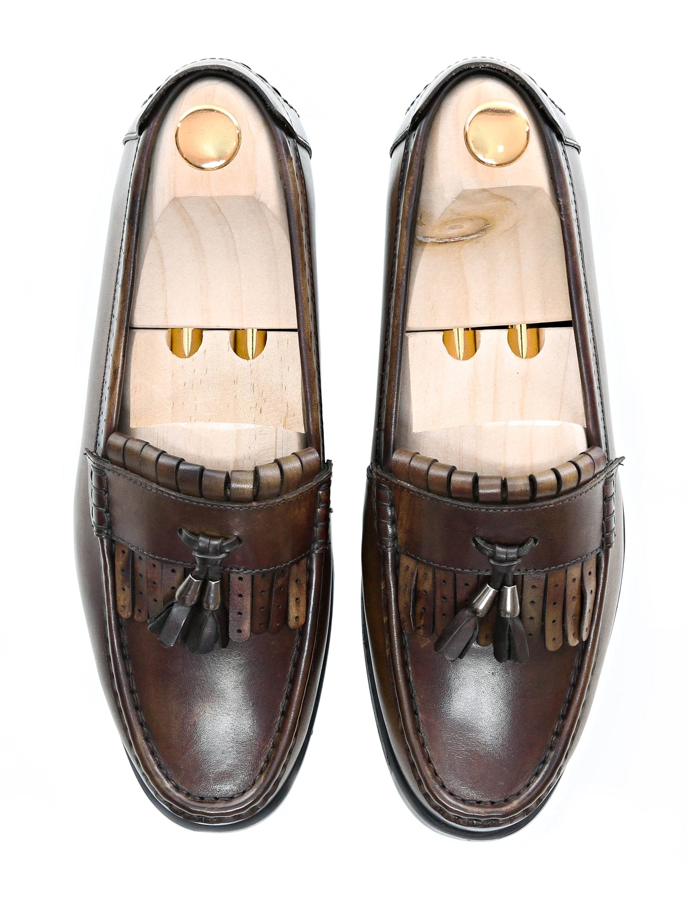 Men's handmade brown leather fringe loafers with tassels and wooden shoe trees