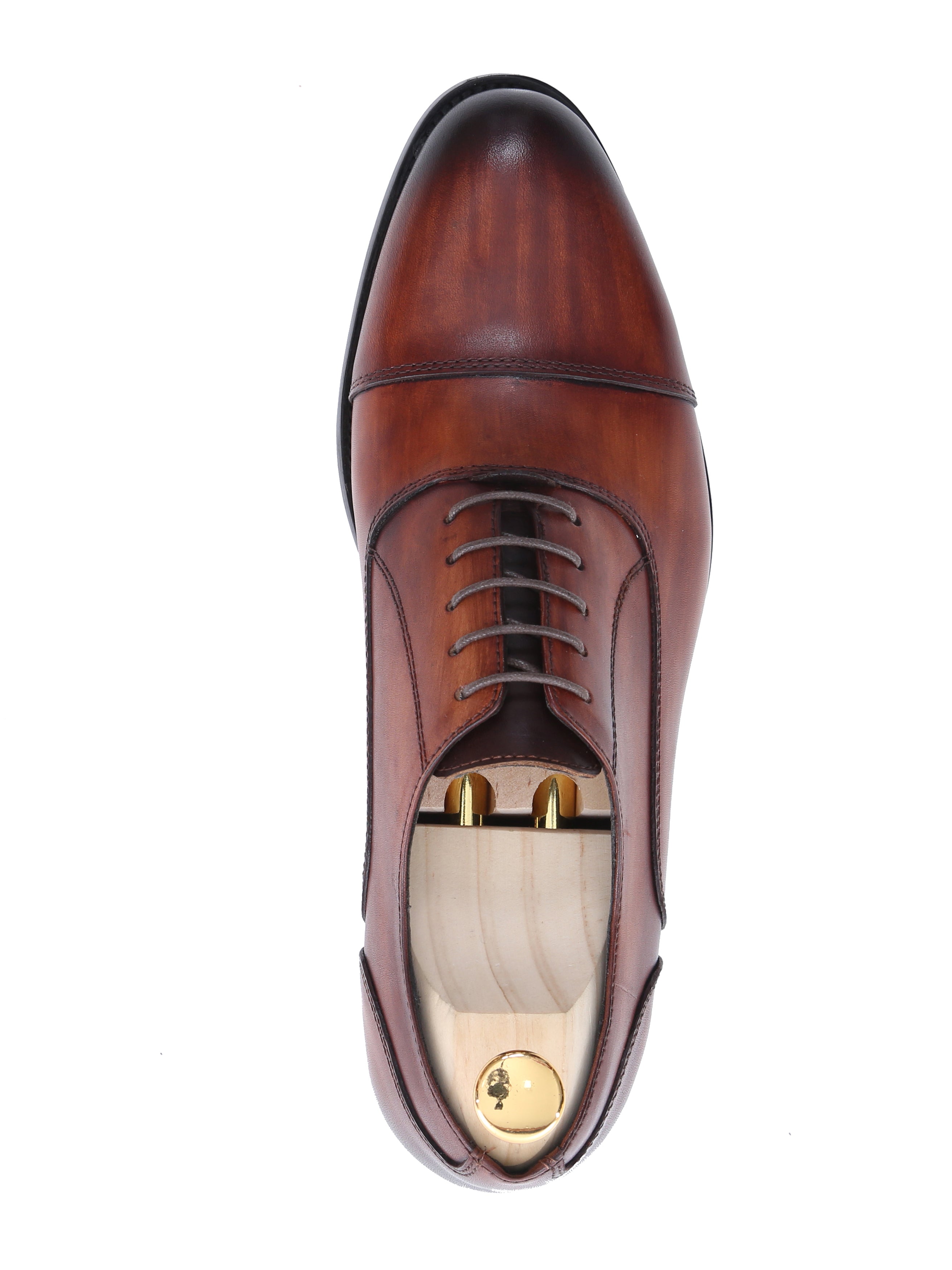 Top view of a cognac tan leather oxford cap toe lace-up men's formal shoe with wooden shoe tree