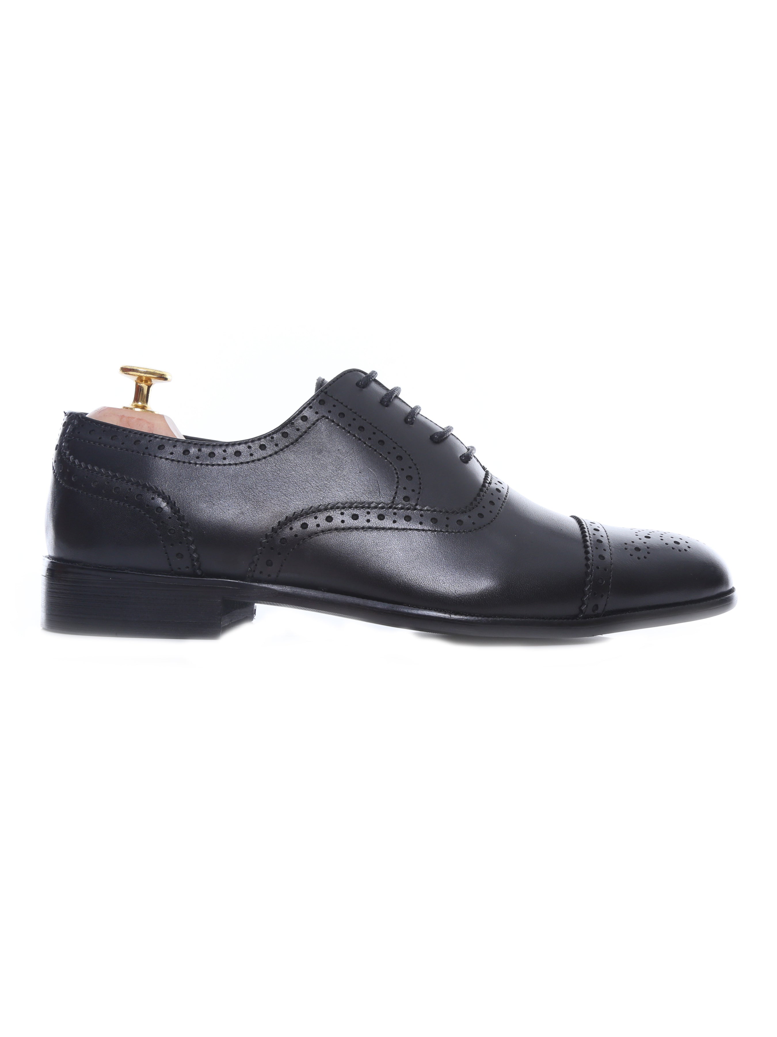 Men’s black leather brogue oxford shoe with perforated detailing on a white background