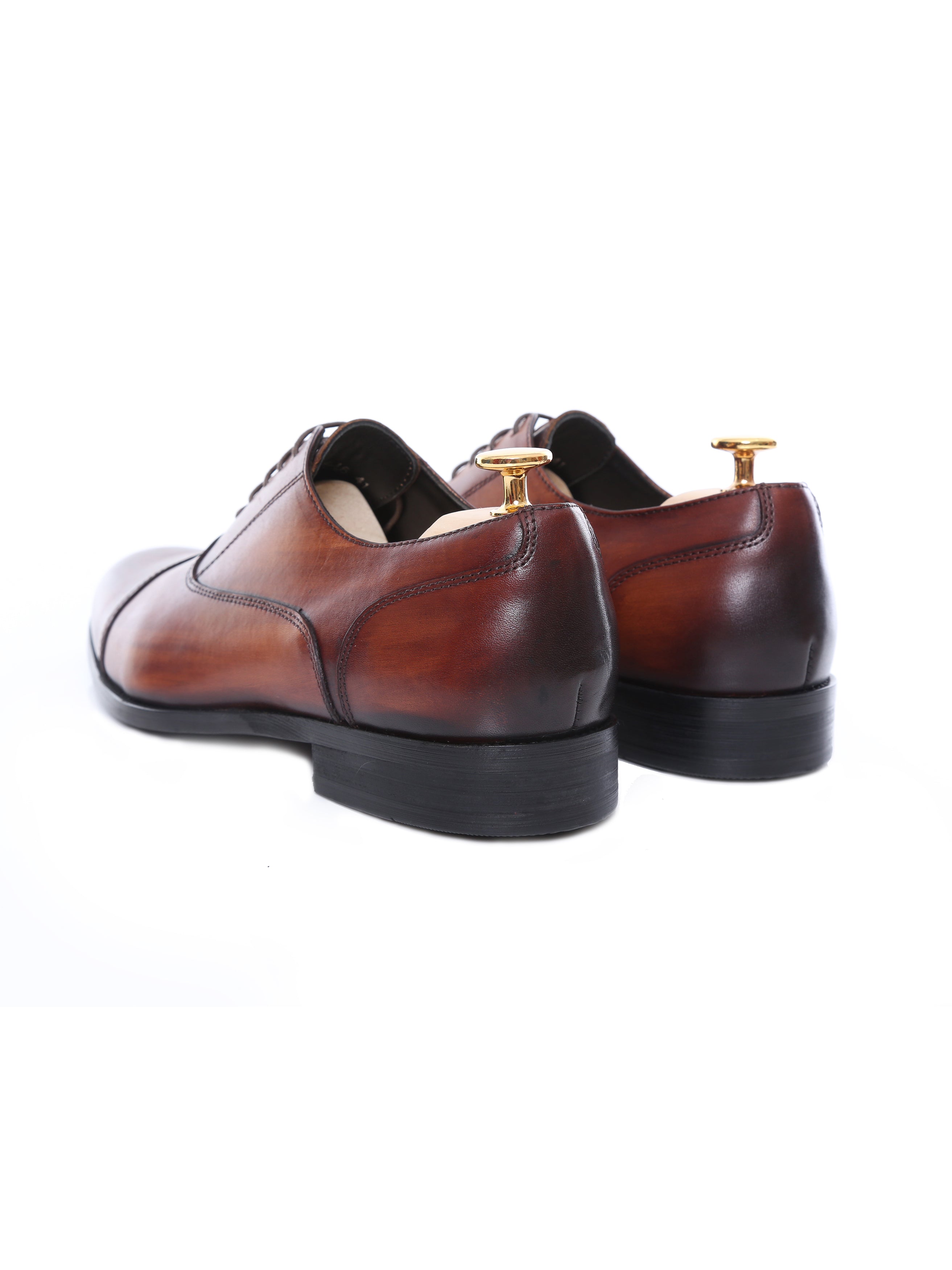 Cognac tan leather Oxford cap toe lace-up men's formal shoes on white background