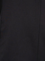Close-up of dark men's suit fabric with fine texture and clean stitching detail