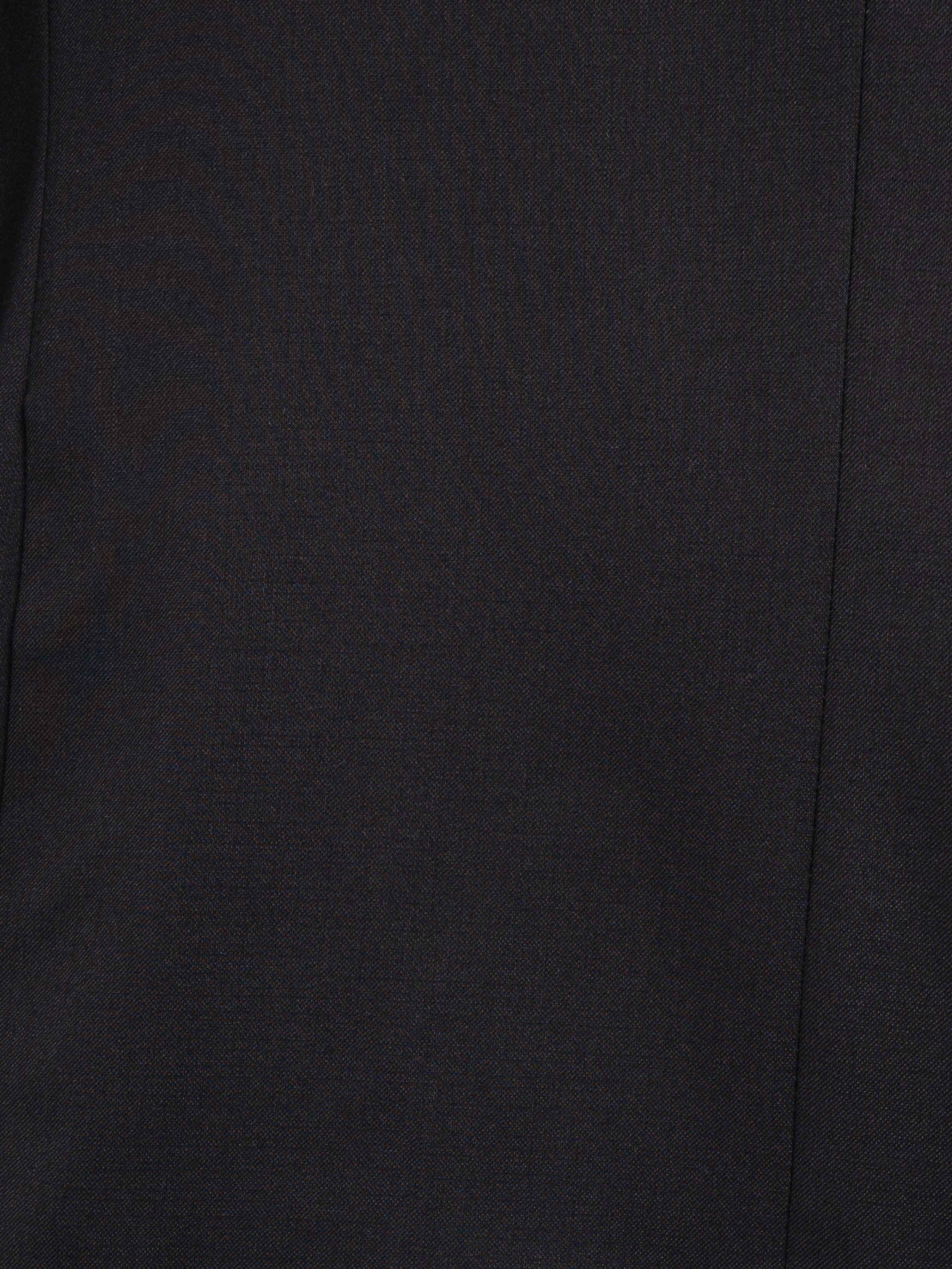 Close-up of dark men's suit fabric with fine texture and clean stitching detail