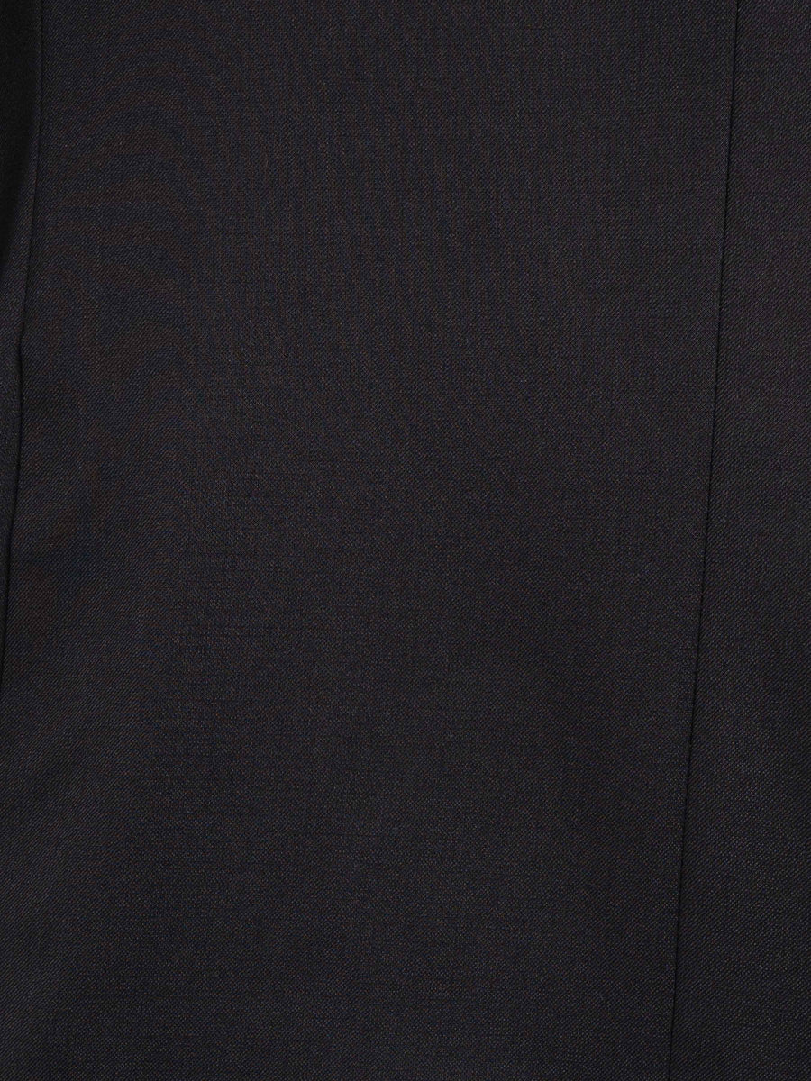 Close-up of dark men's suit fabric with fine texture and clean stitching detail