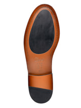 Brown leather shoe sole with black heel, size 41, branded Zeve, showcasing craftsmanship and design details.