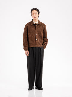 Men's brown suede jacket with black trousers and loafers, styled for formal or smart casual wear.