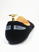 Black men's loafer with silver accents and gold heel detail